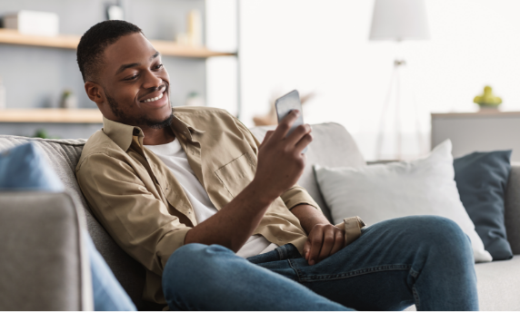 Man shopping at Walmart.com on phone on couch