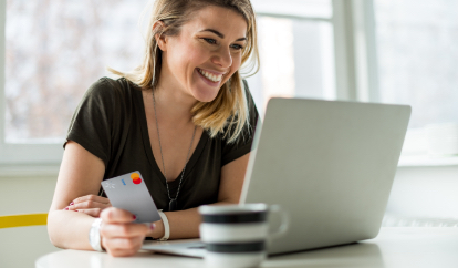 Person at computer with Walmart MoneyCard