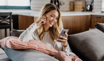 Woman on couch on phone